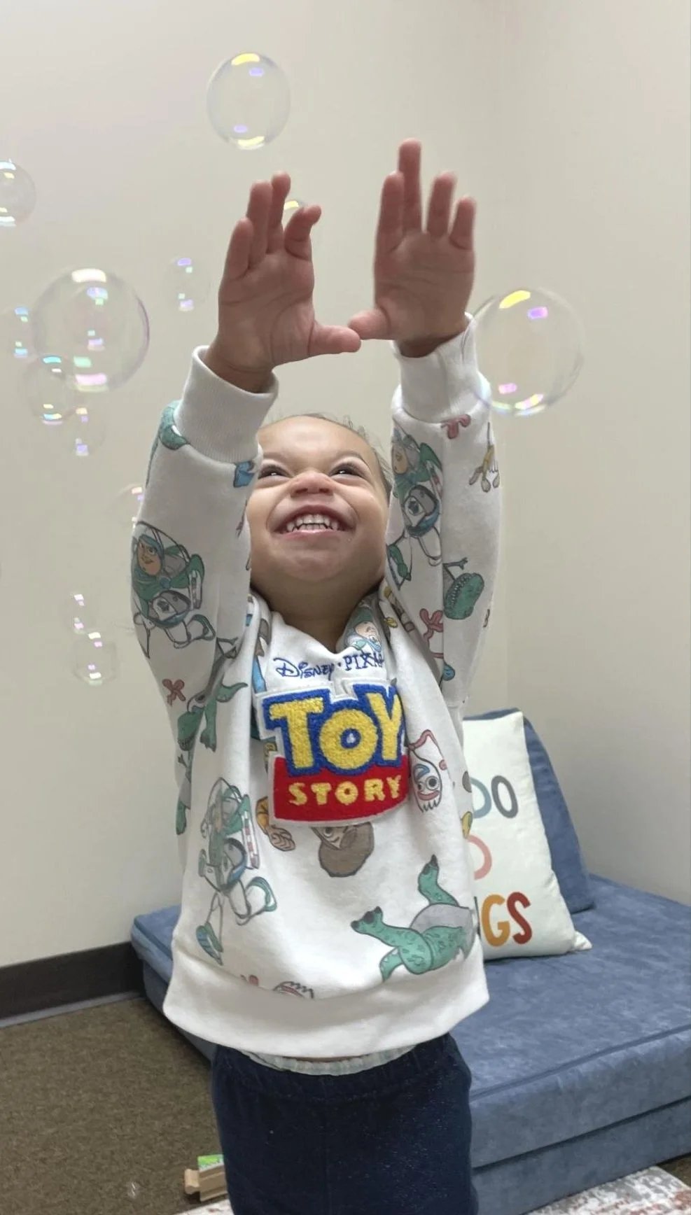 Child smiling with soap bubbles